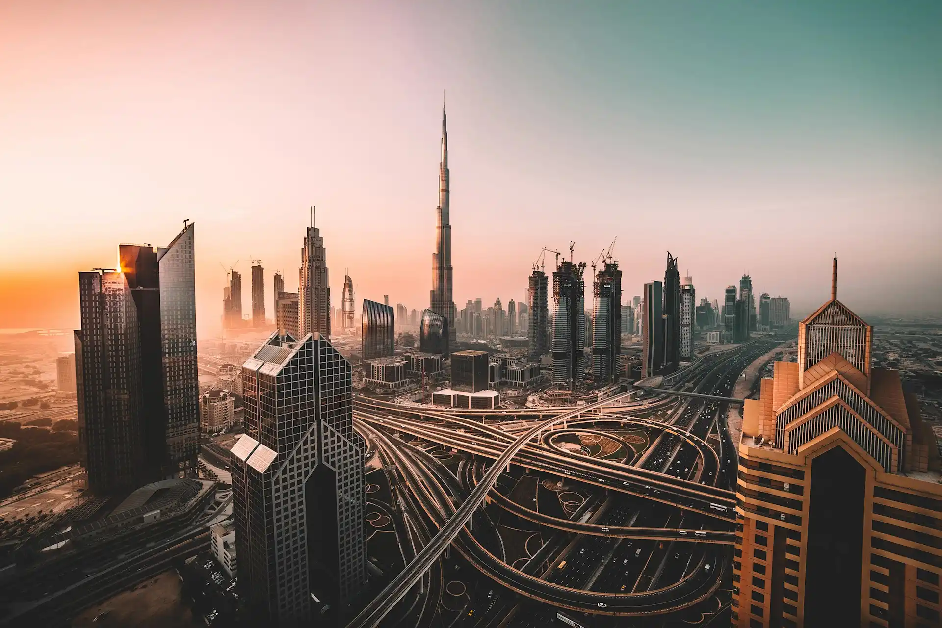 Dubai cityscape skyline at dusk with warm golden lights